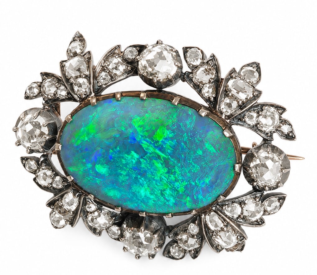 ANTIQUE BLACKOPAL AND DIAMOND BROOCH: ANTIQUE BLACKOPAL AND DIAMOND BROOCH, 8.9 grams.Black opal of approx. 9 ct. with good play of colour.Diamonds bright and lively, totalling approx. 3.20 ct.W. 3.5 cm.