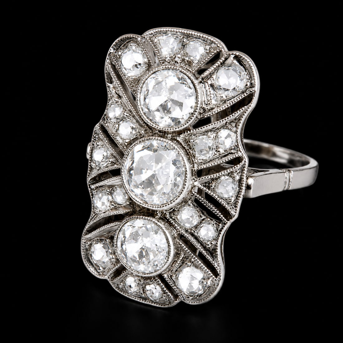 ART-DECO DIAMOND RING: ART-DECO DIAMOND RING,3.9 grams, testing platinum.Bright and lively diamonds, totalling approx. 1.10 ct.Size J 1/2.