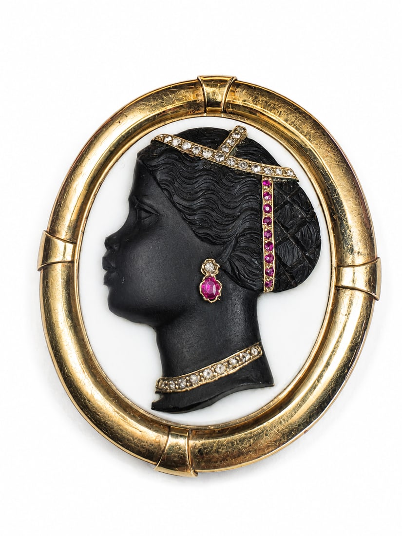 ANTIQUE SARDONYX GEM SET BLACKAMOOR CAMEO BROOCH: ANTIQUE SARDONYX GEM SET BLACKAMOOR CAMEO BROOCH 24.8 grams fine carving with rubies and diamonds in great condition L 5 cm W 4.3 cm