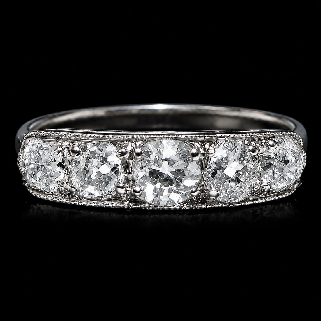 EDWARDIAN DIAMOND 5-STONE RING,: EDWARDIAN DIAMOND 5-STONE RING,Testing platinum.Diamonds bright and lively, totalling approx. 1.15 ct.Size N 1/2.