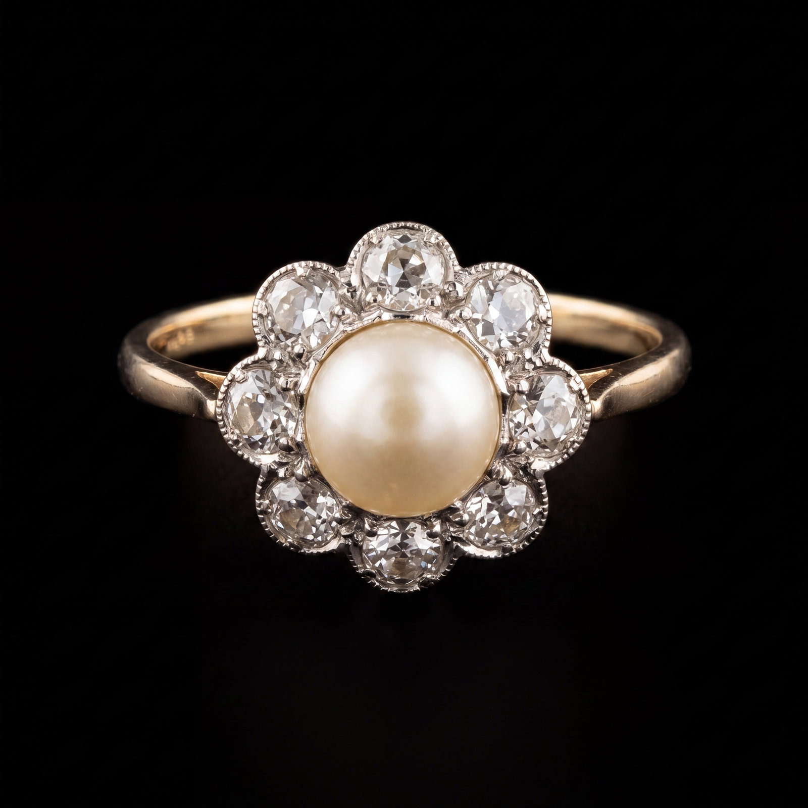 PEARL AND DIAMOND CLUSTER RING: PEARL AND DIAMOND CLUSTER RING,3.1 grams, testing high carat gold.Bright and lively diamonds totalling approx. 0.80 ct.Pearl of approx. 6.6 mm. (untested).Size O.