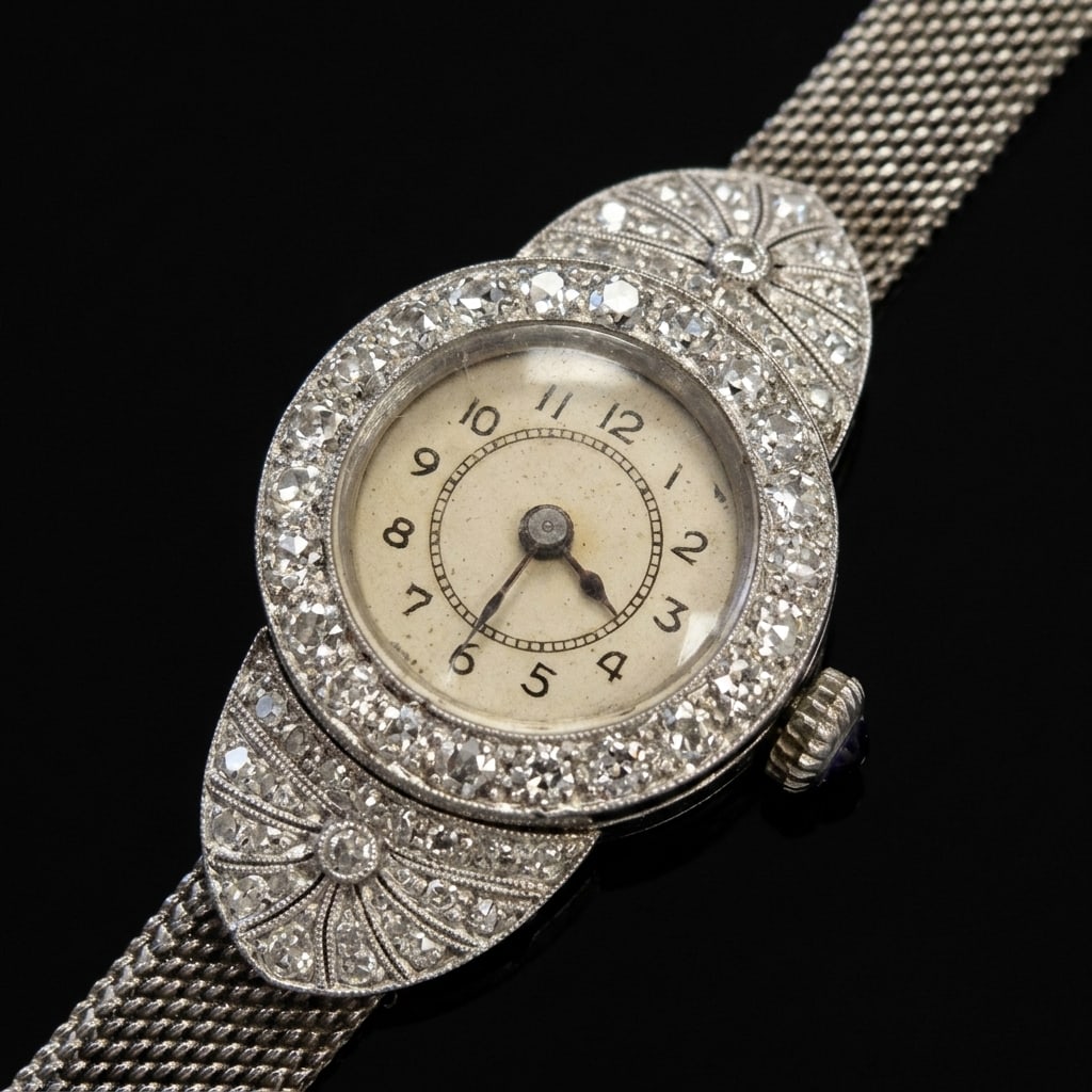 ART-DECO PLATINUM AND DIAMOND WATCH,: ART-DECO PLATINUM AND DIAMOND WATCH,18.3 grams.Diamonds bright and lively.Manual winding.Mesh link adjustable strap.