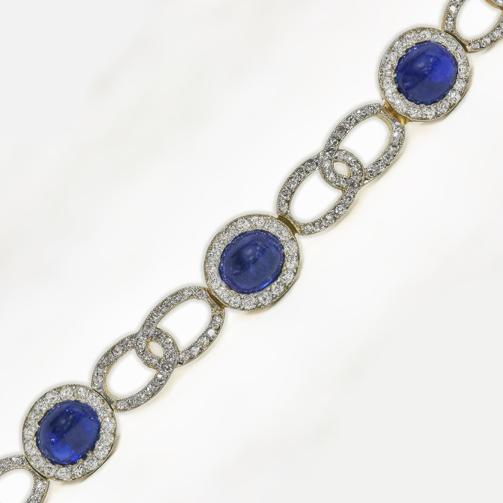 MAGNIFICENT EDWARDIAN SAPPHIRE AND DIAMOND BRACELET: MAGNIFICENT EDWARDIAN SAPPHIRE AND DIAMOND BRACELET 16.6 grams gold and platinum Rich vibrant cabochon sugarloaf sapphires with no abrasions approx. 16 ct. bright lively diamonds approx. 4 ct. L 18 cm