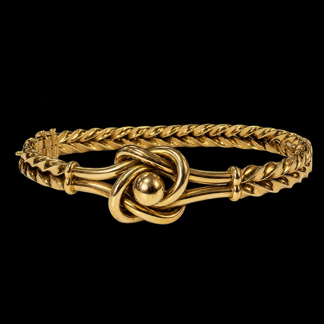 VICTORIAN GOLD KNOT BANGLE: VICTORIAN GOLD KNOT BANGLE,10.1 grams.Knotted knot to the top, the band of twisted band design.Inner diam. 5.8 cm.