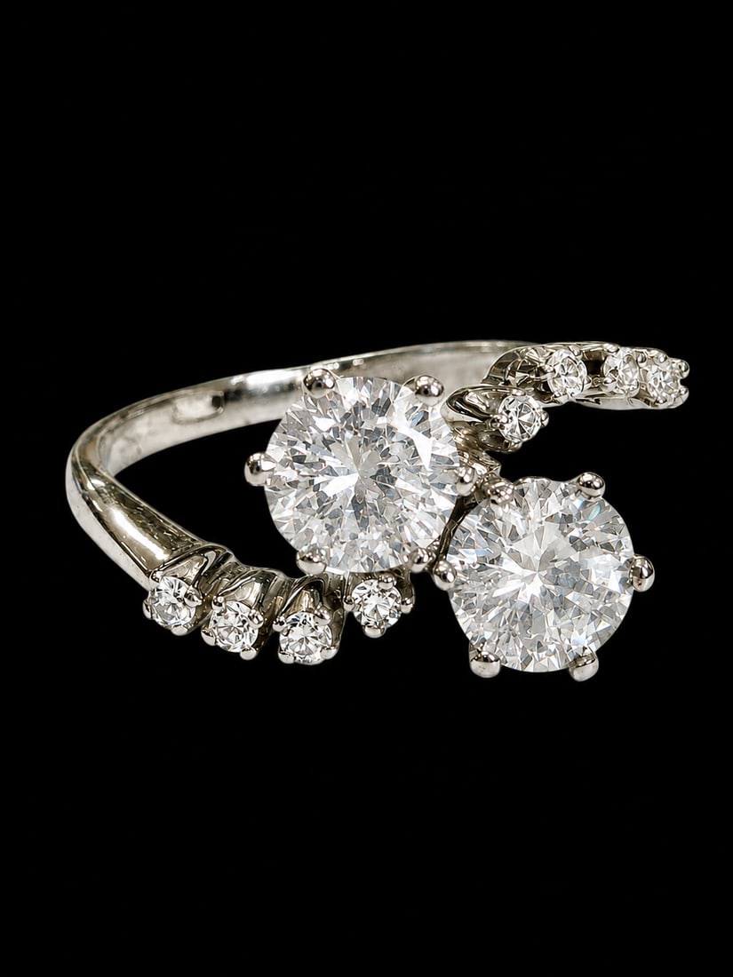 DIAMOND TOI-ET-MOI RING,: DIAMOND TOI-ET-MOI RING,3 grams, testing 18 ct. gold.Bright and lively diamonds, totalling approx. 1.20 ct.Size L.