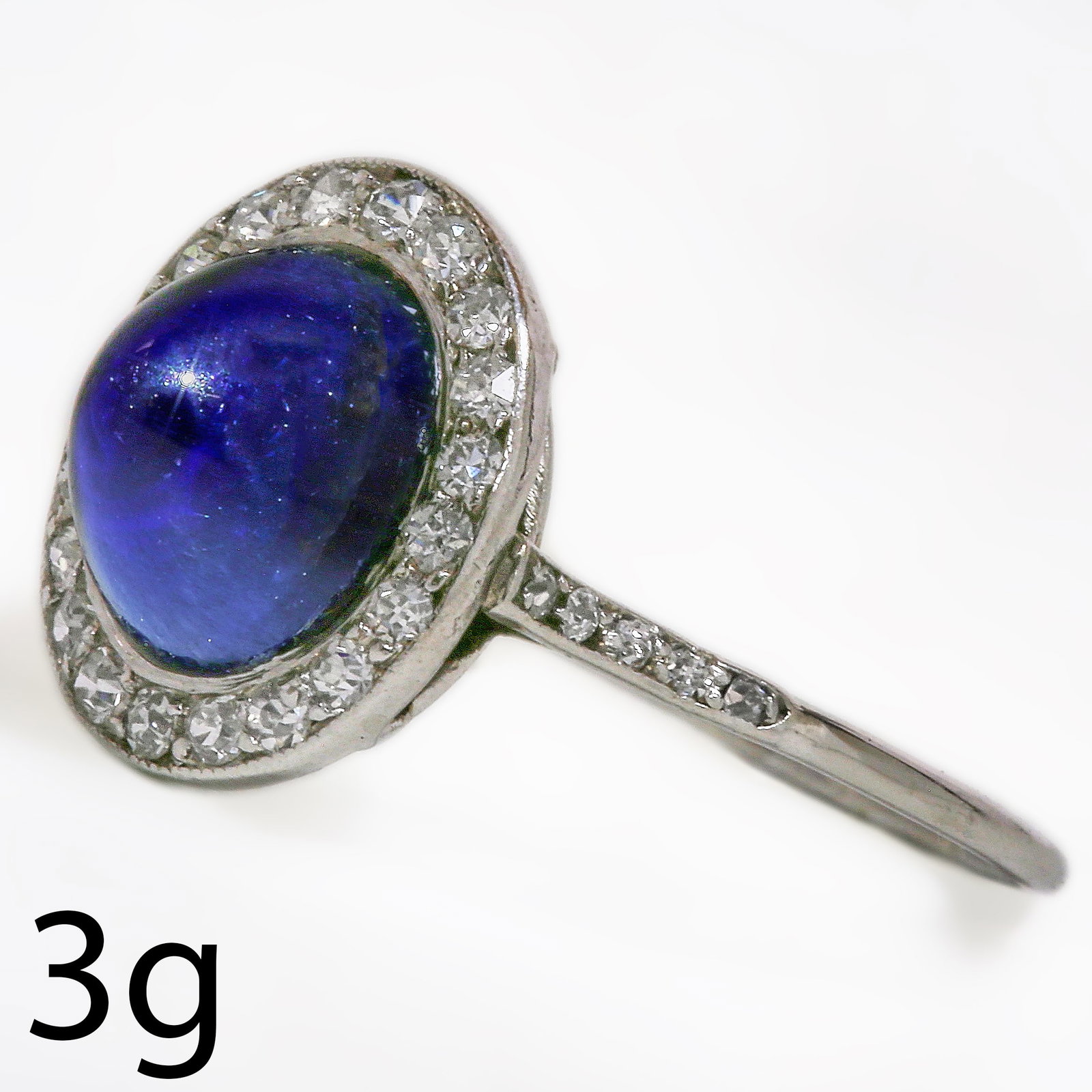 ELEGANT ART DECO SUGAR LOAF SAPPHIRE AND DIAMOND CLUSTER RING: ELEGANT ART DECO SUGAR LOAF SAPPHIRE AND DIAMOND CLUSTER RING 3 grams platinum rich vibrant sapphire with no abrasions approx 4.30 ct.bright lively old cut diamonds in great condition fine craftsmansh