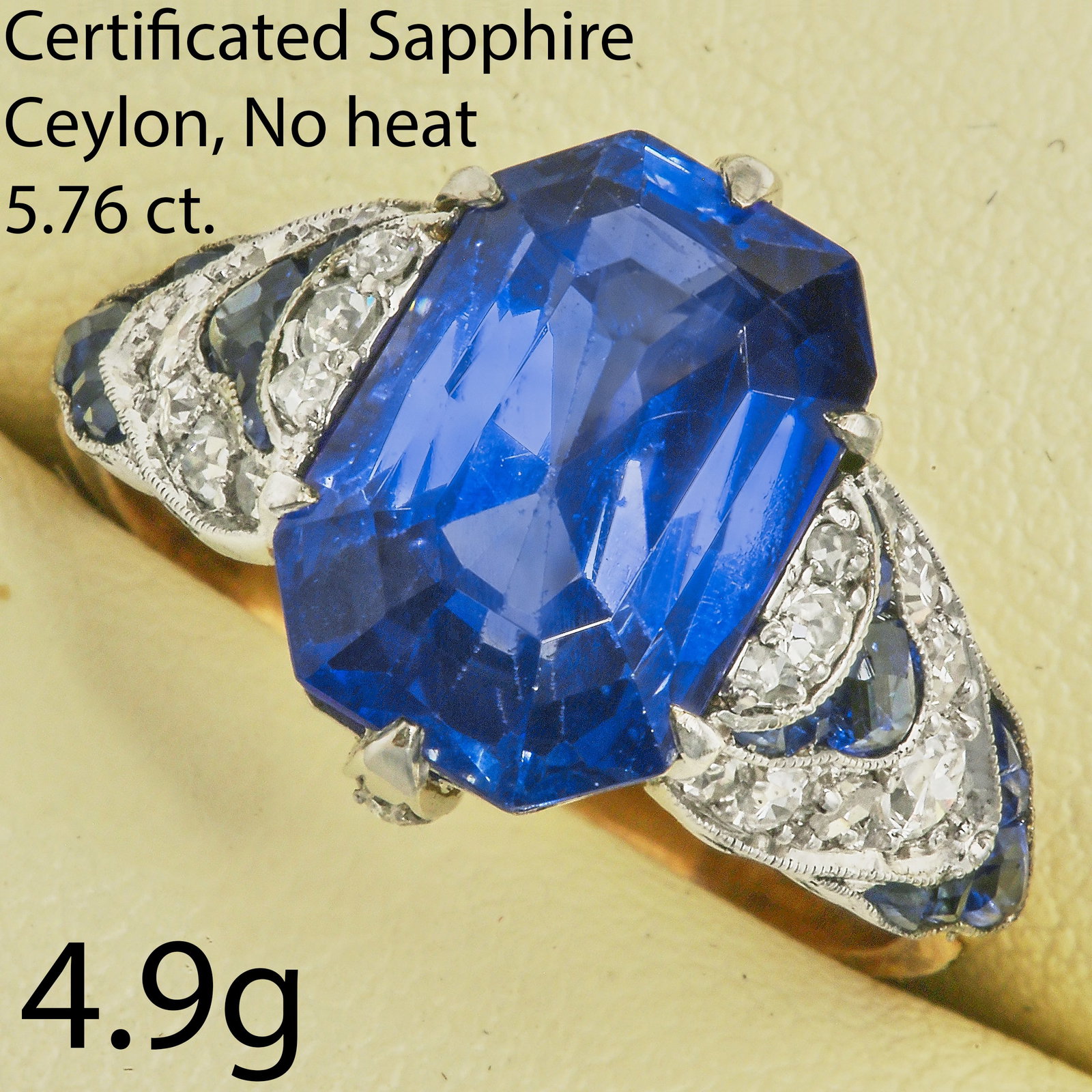 CERTIFICATED ART-DECO 5,06 CT. BURMA SAPPHIRE AND DIAMOND RING,: CERTIFICATED ART-DECO 5,06 CT. BURMA SAPPHIRE AND DIAMOND RING,testing high carat gold and platinum.Rich and vibrant sapphire of approx. 5.06 ct. (Certificated, Burma, No Heat).The shoulders with brig