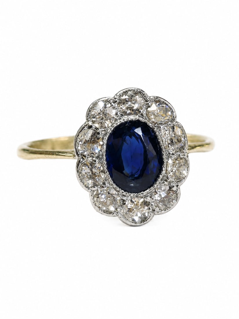 SAPPHIRE AND DIAMOND CLUSTER RING,: SAPPHIRE AND DIAMOND CLUSTER RING,testing 18 ct. gold and platinum.Lovely sapphire.Diamonds bright and lively.Size J 1/2.