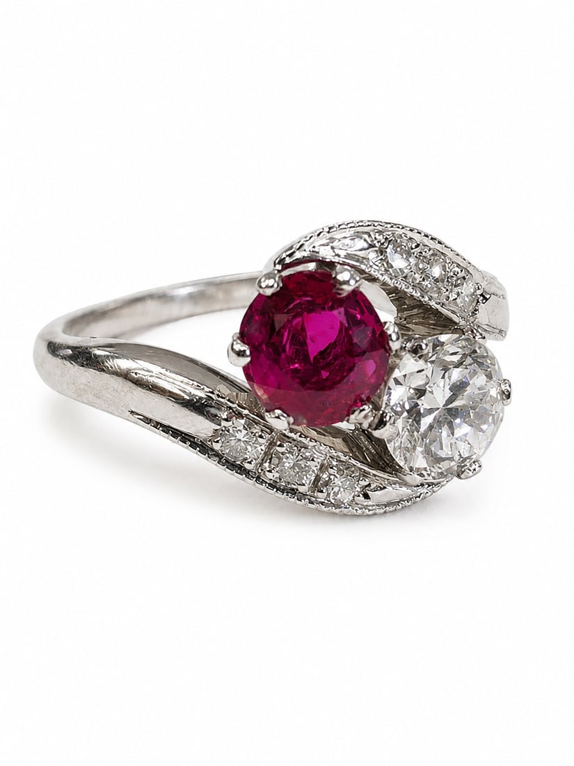 RUBY AND DIAMOND TOI-ET-MOI TWIST RING,: RUBY AND DIAMOND TOI-ET-MOI TWIST RING,5,8 grams, testing 18 ct. gold.Rich and vibrant ruby.Diamonds bright and lively.Size O,
