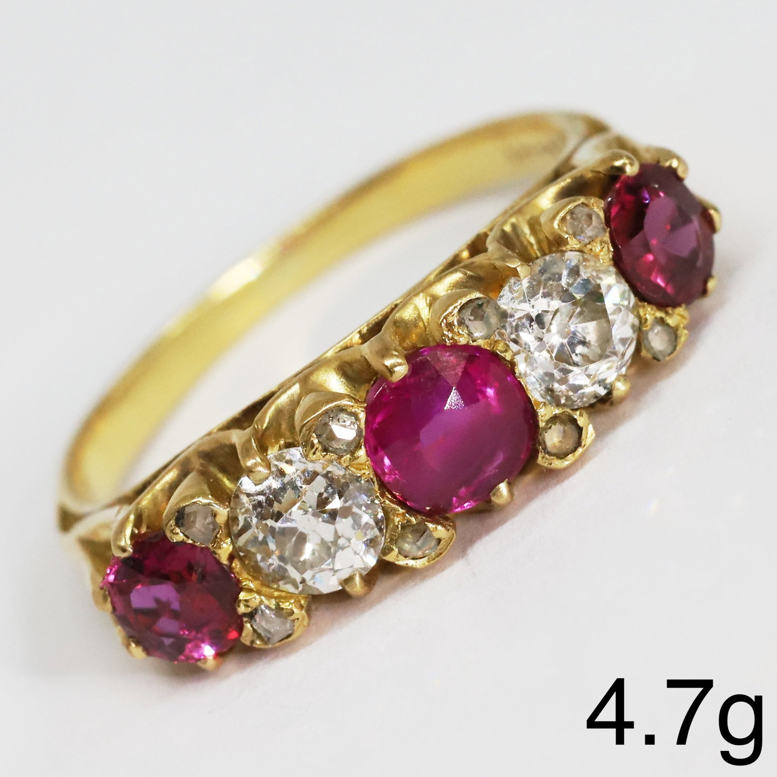 RUBY AND DIAMOND 5-STONE RING,: RUBY AND DIAMOND 5-STONE RING,4,7 grams, testing 18 ct. gold.Rich and vibrant rubies, totalling approx. 1.35 ct.Diamonds bright and lively, totalling approx. 0.75 ct.Size N 1/2.