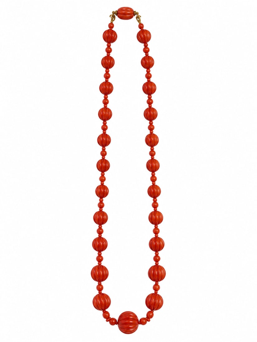 UNUSUAL ANTIQUE CARVED CORAL NECKLACE: UNUSUAL ANTIQUE CARVED CORAL NECKLACE,29.7 grams, testing 18 ct. gold. Rich and vibrant carved larger coral with great lustre.L. 47 cm.