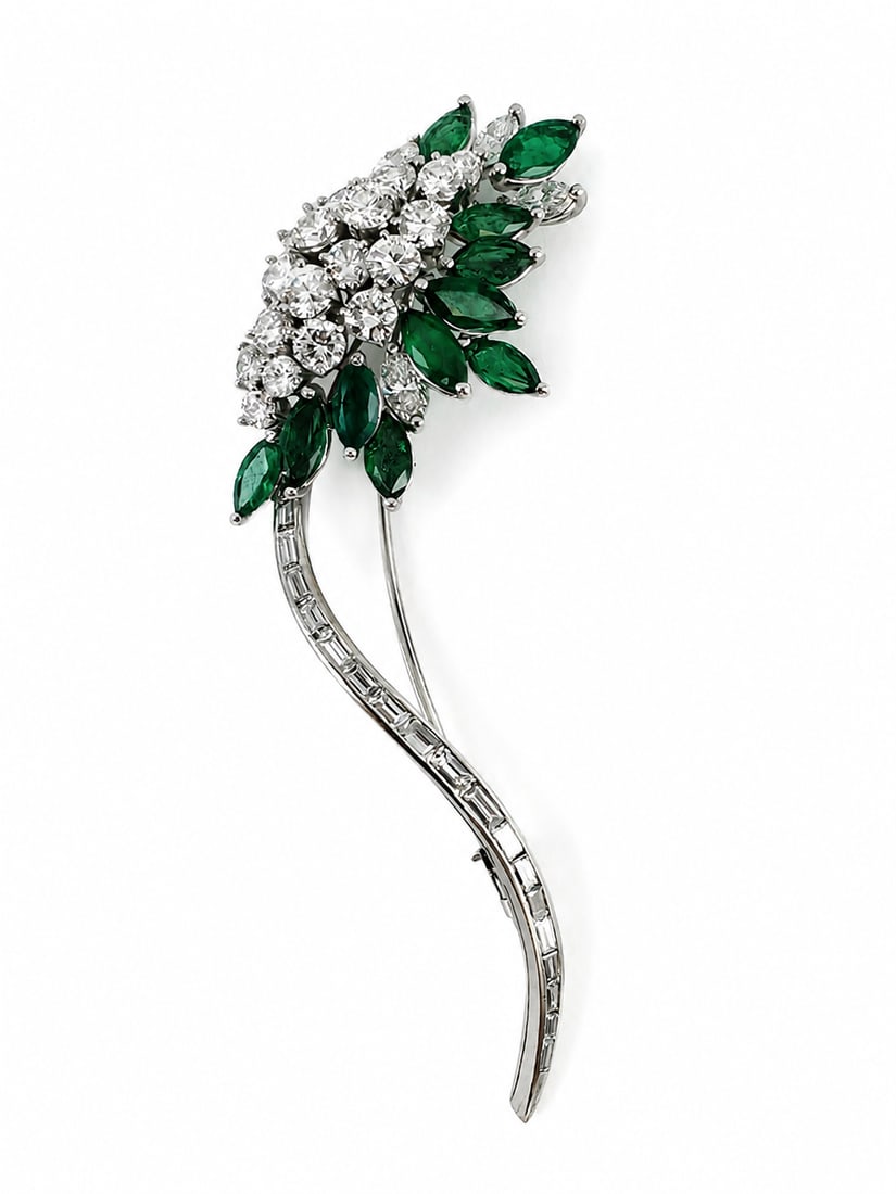 ELEGANT EMERALD AND DIAMOND BROOCH: ELEGANT EMERALD AND DIAMOND BROOCH 10.8 grams rich vibrant emeralds, approx 3.30 ct bright lively diamonds, approx 3.50ct in excellent condition fine craftsmanship L 6.9 cm