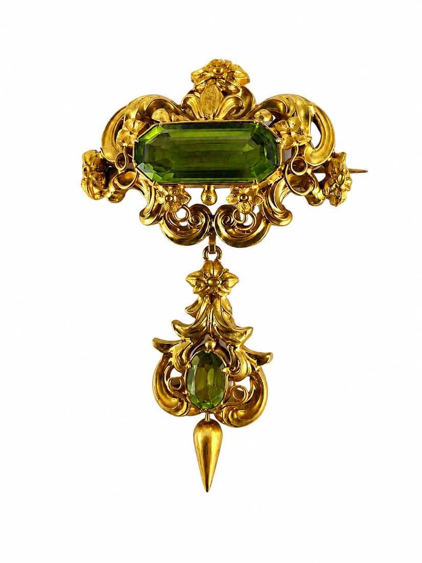 VICTORIAN PERIDOT BROOCH: VICTORIAN PERIDOT BROOCH, 11.1 grams, testing high carat gold.Rich and vibrant peridots, totalling approx. 8.50 ct.L. 6.4 cm.