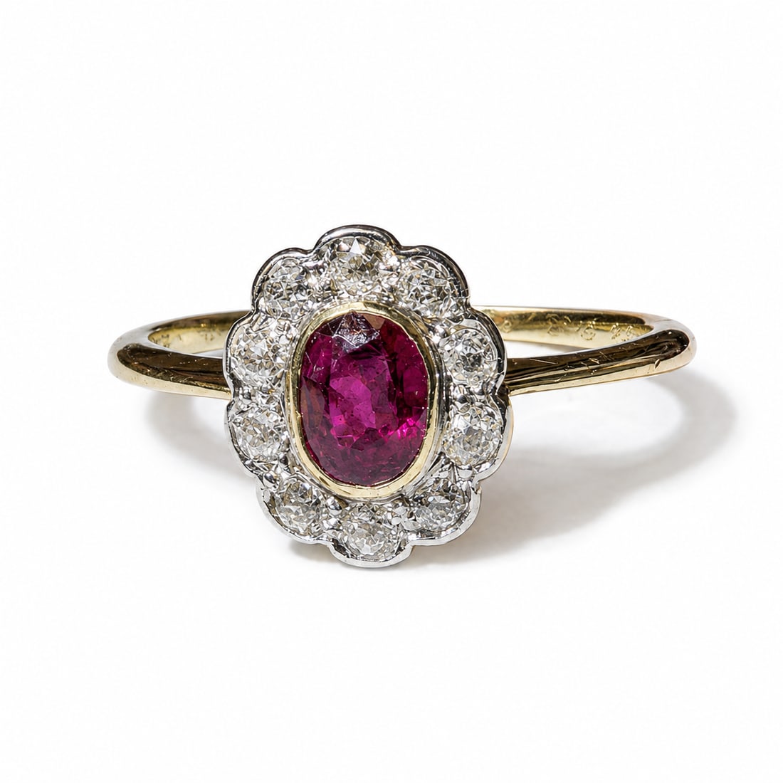 RUBY AND DIAMOND CLUSTER RING: RUBY AND DIAMOND CLUSTER RING,testing high carat gold.Rich and vibrant ruby of approx. 0.52 ct.Diamonds bright and lively.Size K 1/2.