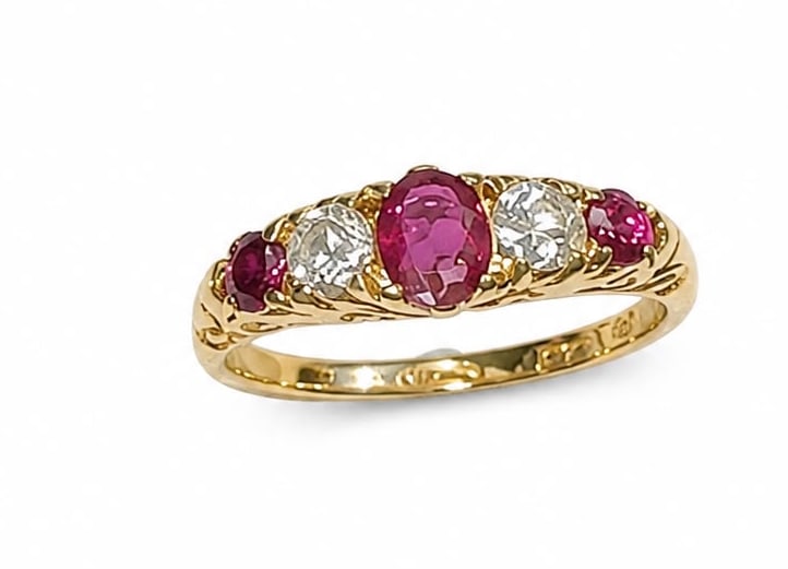 RUBY AND DIAMOND 5-STONE RING: RUBY AND DIAMOND 5-STONE RING,3.2 grams, 18 ct. gold.Rich and vibrant rubies.Diamonds bright and lively.Size O.