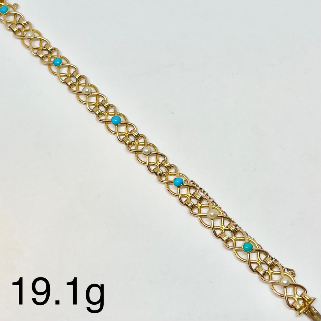 EDWARDIAN TURQUOISE AND PEARL BRACELET: EDWARDIAN TURQUOISE AND PEARL BRACELET,19.1 grams, 15 ct. gold.Alternately set with a turquoise and pearl.L. 18.5 cm.
