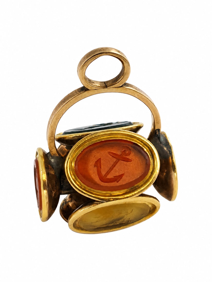 AN ANTIQUE GOLD ROTATING MULTI-SEAL FOB PENDANT,: AN ANTIQUE GOLD ROTATING MULTI-SEAL FOB PENDANT,8.4 grams 7 intaglios in great condition L 2.6 cm