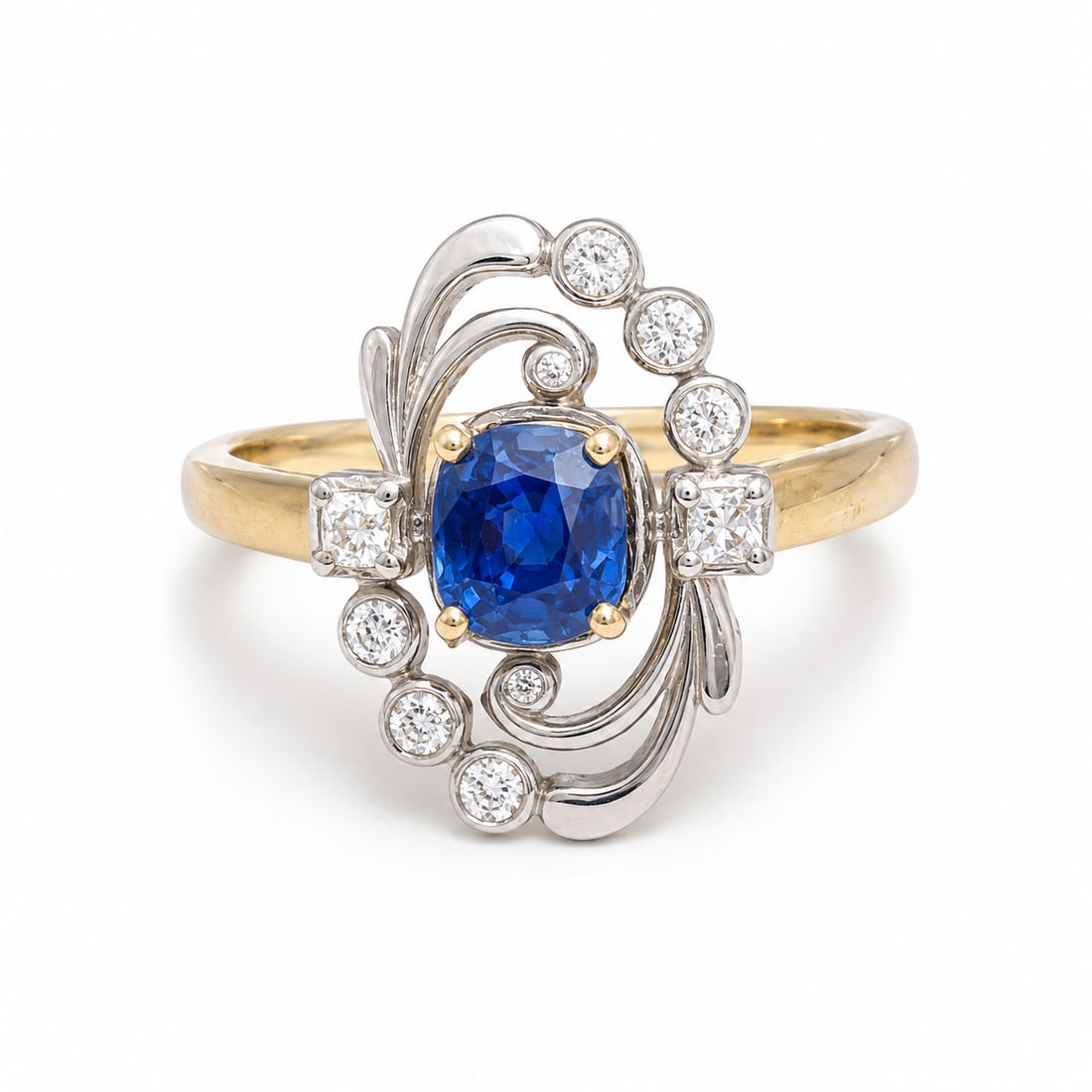 SCARAB LONDON, SAPPHIRE AND DIAMOND CLUSTER RING: SCARAB LONDON, SAPPHIRE AND DIAMOND CLUSTER RING,6 grams, 18 ct. gold.Bright and lively sapphire.Diamonds bright and lively.Size P.