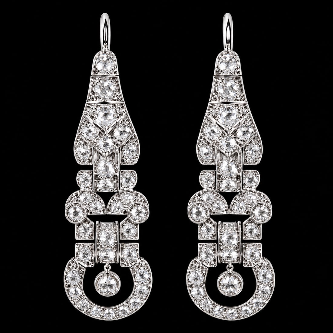 PAIR OF ART-DECO DIAMOND DROP EARRINGS: PAIR OF ART-DECO DIAMOND DROP EARRINGS,15 grams, testing platinum.Articulated.Diamonds bright and lively, totalling approx. 4 ct.L. 5.3 cm.