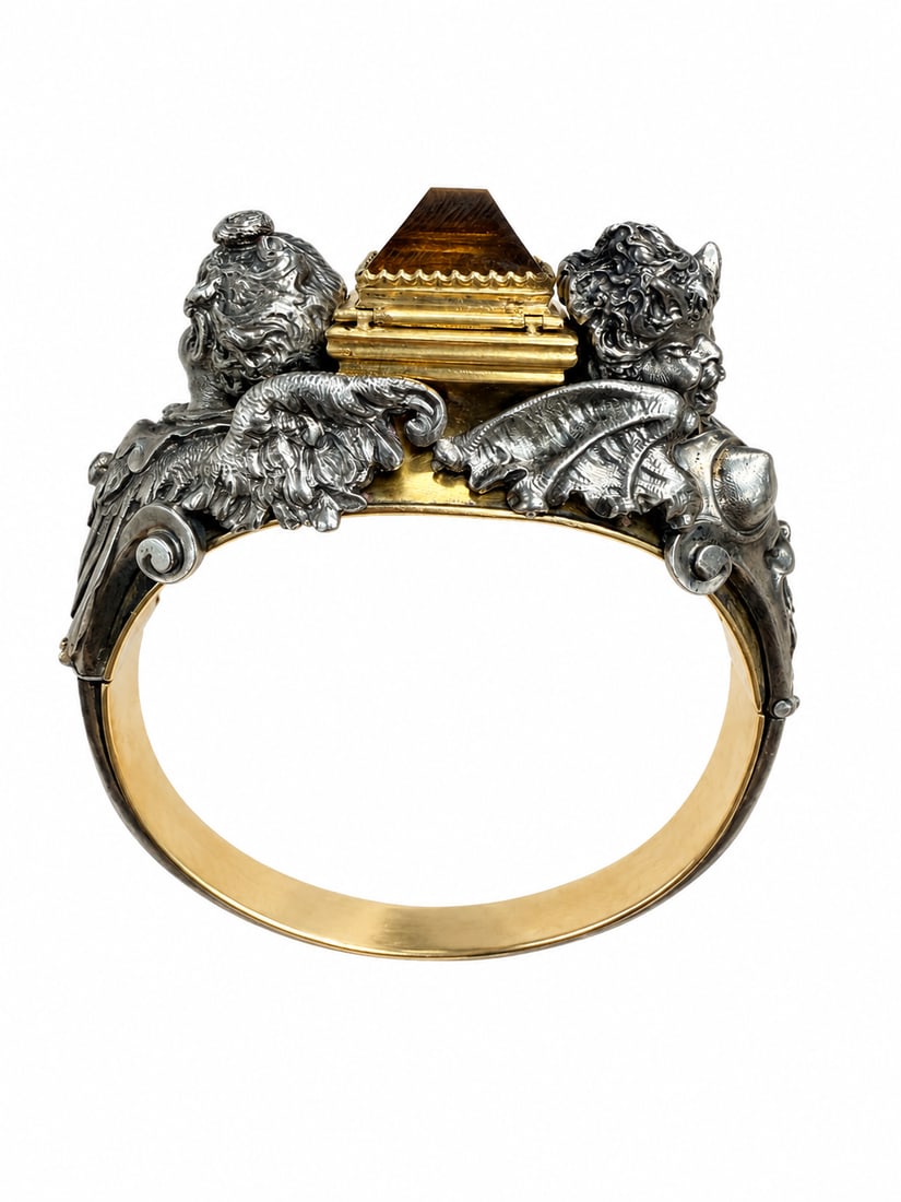 FROMENT MEURICE (attrib.) CITRINE CHERUB OPENING BANGLE: FROMENT MEURICE (attrib.) CITRINE CHERUB OPENING BANGLE,78.1 grams, testing high cart gold and silver.The design flanked by two opposing winged figures, modelled in deeply chased silver with strong sc