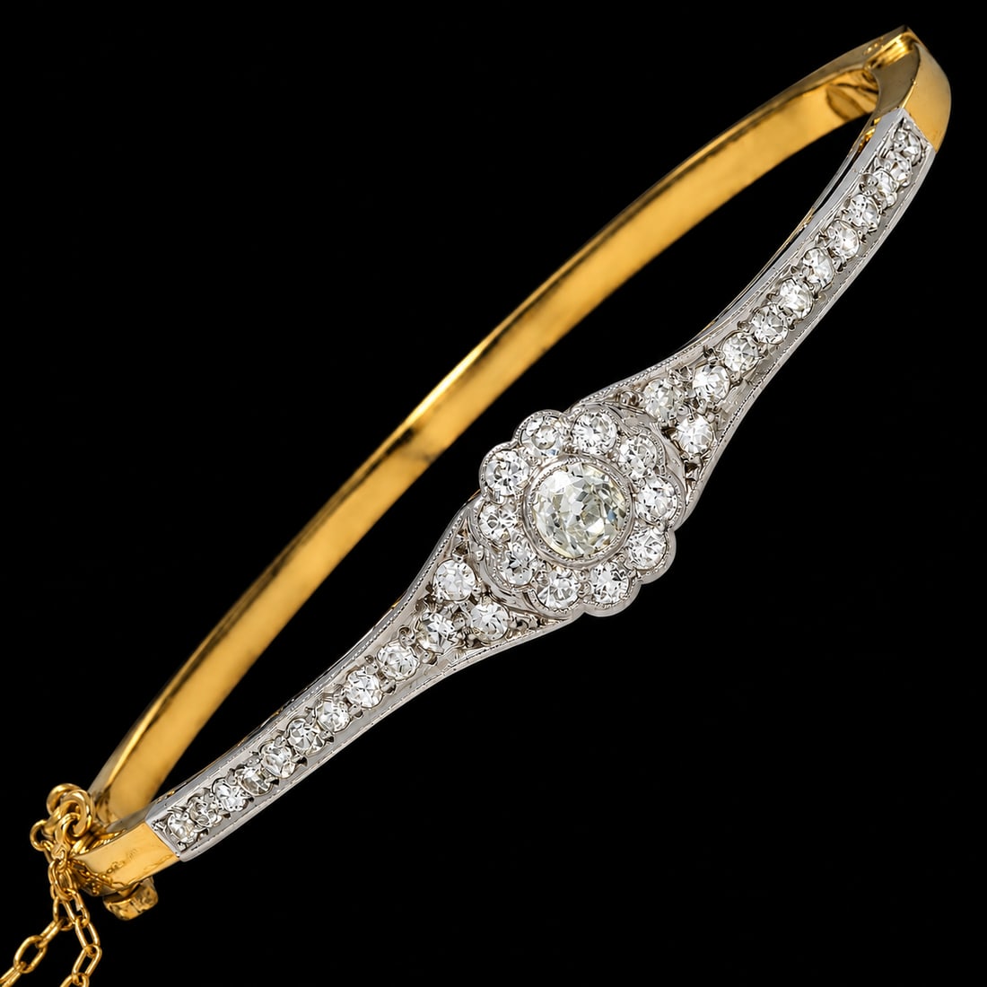 EDWARDIAN DIAMOND HINGED BANGLE: EDWARDIAN DIAMOND HINGED BANGLE 10.5 grams high carat gold and platinum bright lively old cut diamonds no dents in great condition