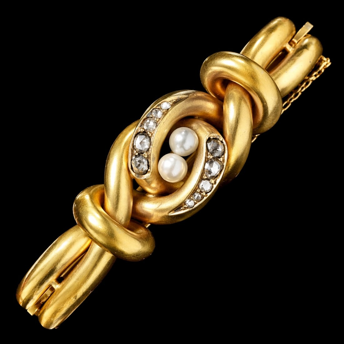 FINE ANTIQUE MOONSTONE AND DIAMOND HINGED BANGLE: FINE ANTIQUE MOONSTONE AND DIAMOND HINGED BANGLE,26,7 grams, testing high carat gold.bright and lively diamonds.Lovely cabochon cut moonstone with nice blue shiller.Inner diam. 5.9 cm.