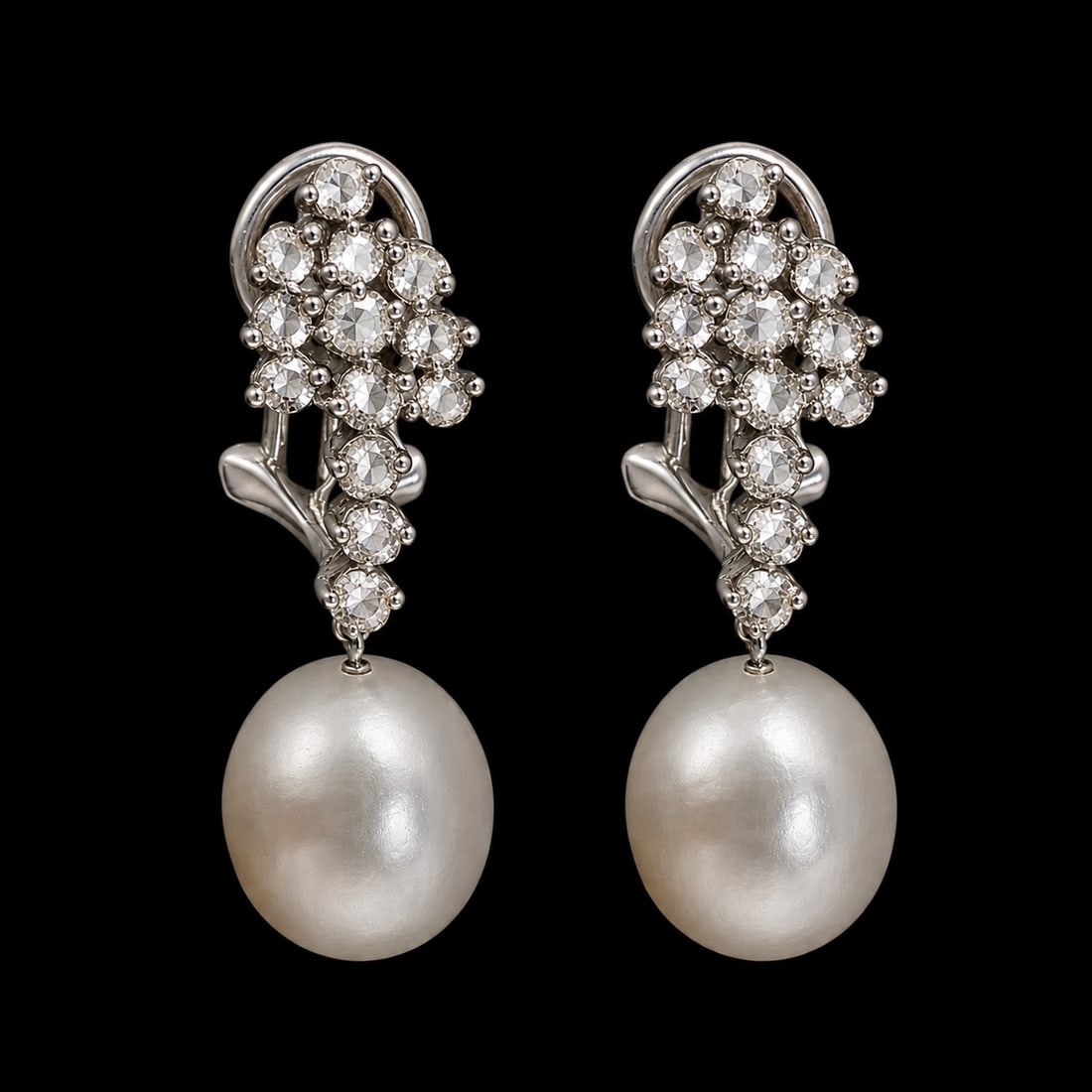 PAIR OF PEARL AND DIAMOND EARRINGS: PAIR OF PEARL AND DIAMOND EARRINGS,8.1 grams, testing 18 ct. gold.Diamonds bright and lively.Pearls untested.L. 3 cm.