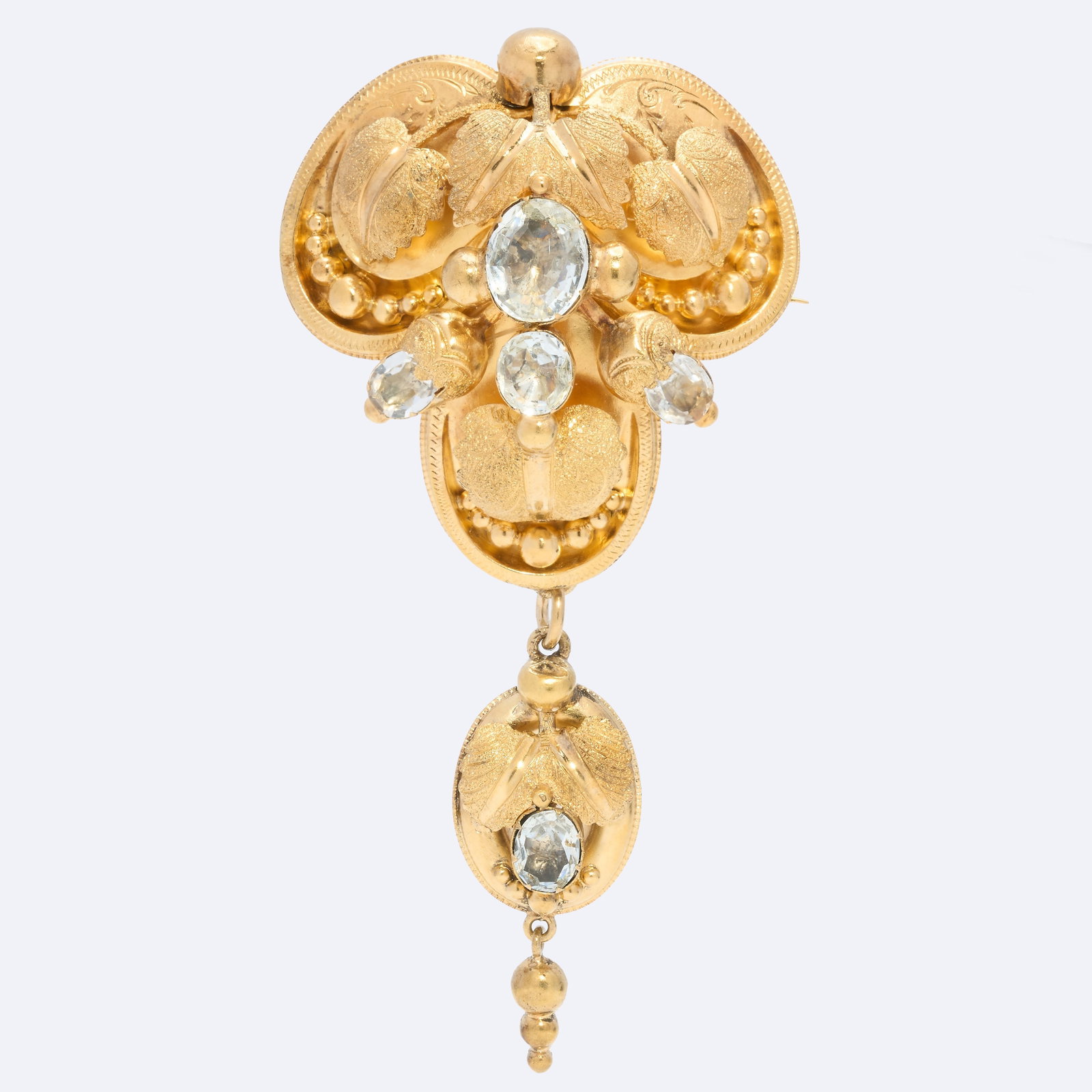VICTORIAN AQUAMARINE BROOCH: VICTORIAN AQUAMARINE BROOCH,9.2 grams, testing high carat gold. Lovely 3-dimensional floral design.Bottom drop removable.L. 7,4 cm.