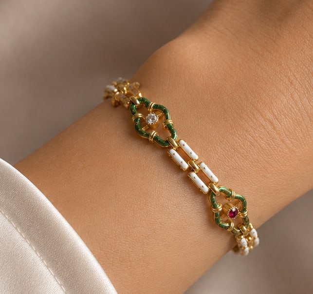 VICTORIAN RUBY DIAMOND AND ENAMEL BRACELET: VICTORIAN RUBY DIAMOND AND ENAMEL BRACELET,13.4 grams, testing 18 ct. gold.Rich and vibrant rubies.Bright and lively diamond.Lovely green and white enamel.L. 18.5 cm.