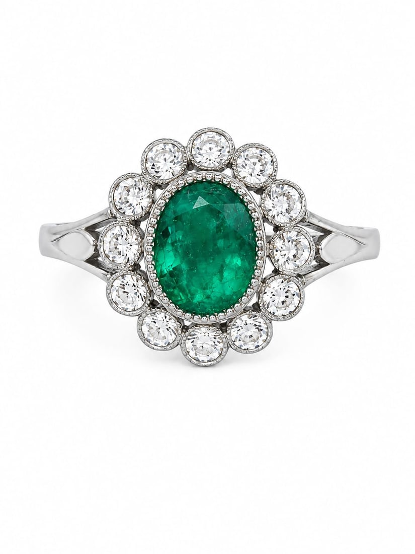 EMERALD AND DIAMOND CLUSTER RING: EMERALD AND DIAMOND CLUSTER RING,5,3 grams, testing platinum.Rich and vibrant emerald.Diamonds bright and lively.Size M.