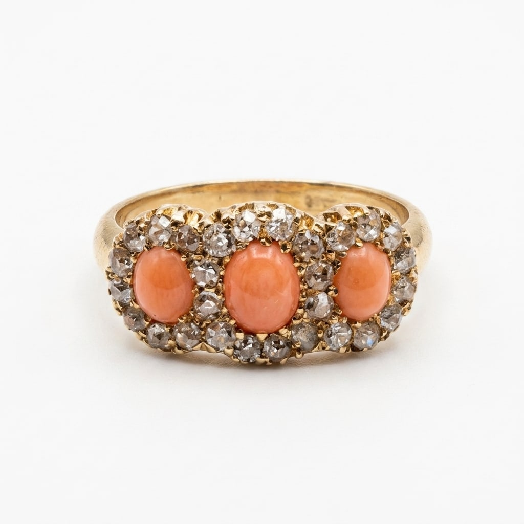 CORAL AND DIAMOND TRIPLE CLUSTER RING: CORAL AND DIAMOND TRIPLE CLUSTER RING,4,1 grams, 18 ct. gold.Rich and vibrant corals with good lustre.Diamonds bright and lively.Size M 1/2.
