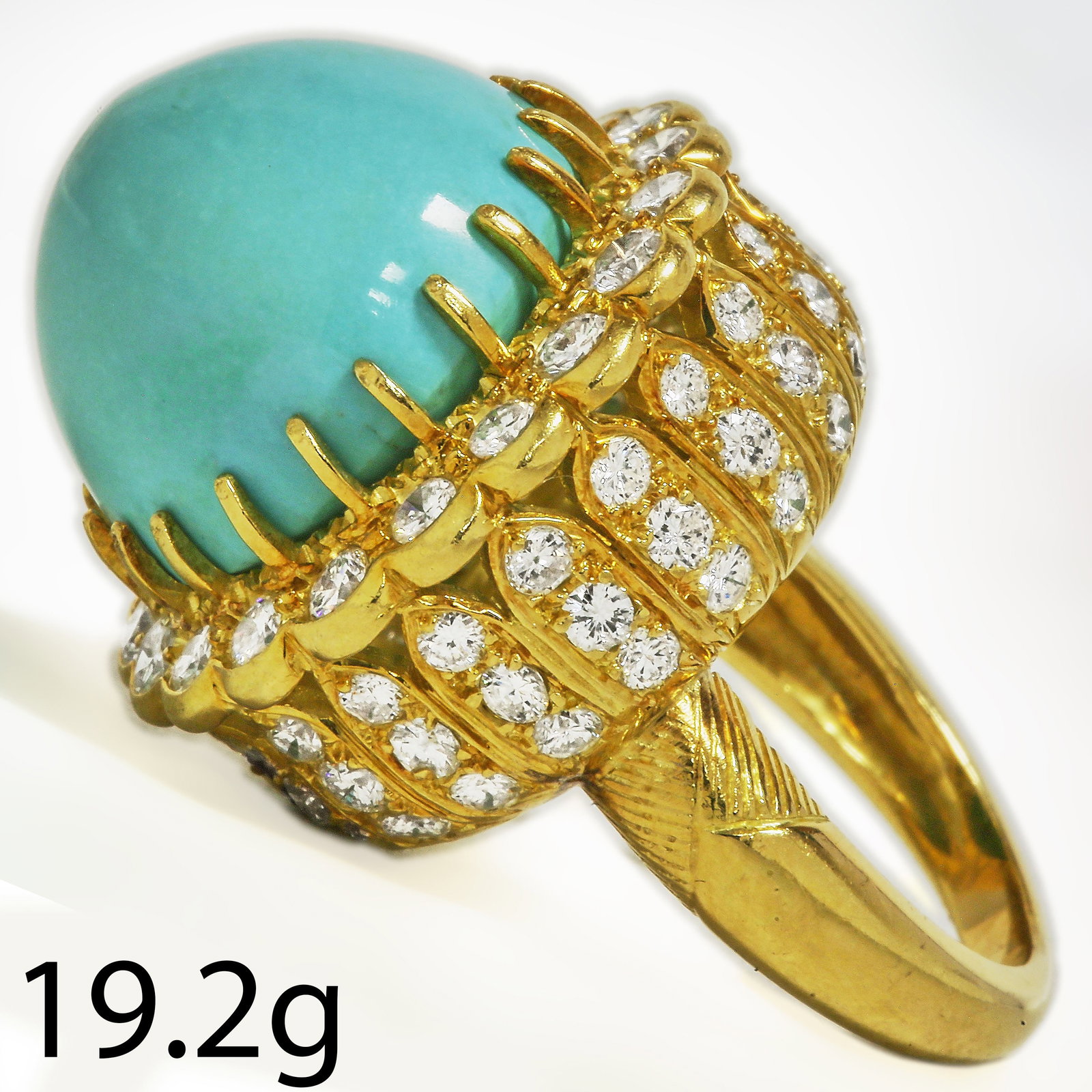 LARGE TURQUOISE AND DIAMOND CLUSTER RING: LARGE TURQUOISE AND DIAMOND CLUSTER RING,19,2 grams, testing high carat gold.Diamonds bright and lively.Diamonds in the cluster and the side of the head, totalling approx. 3.60 ct.Size I.
