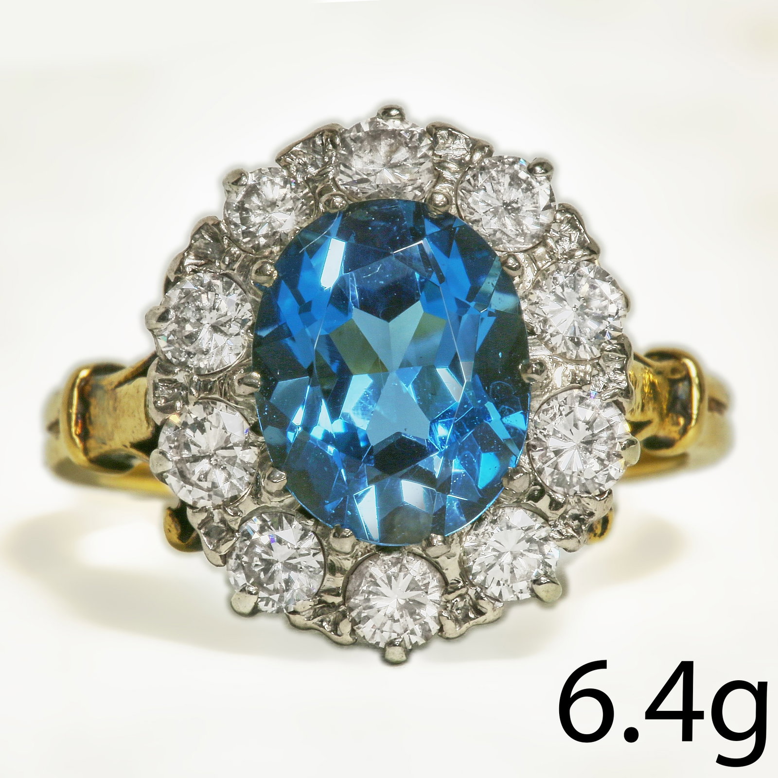 BLUE ZIRCON AND DIAMOND CLUSTER RING: BLUE ZIRCON AND DIAMOND CLUSTER RING 6.4 grams high carat gold vibrant zircon with no abrasionsapprox 3.15 ct bright lively diamonds approx 1 ct