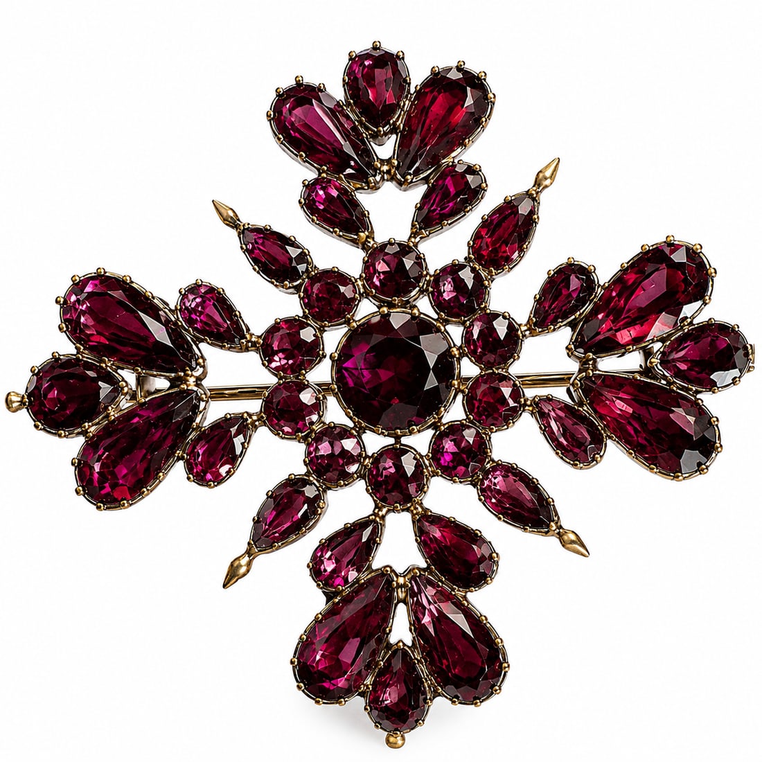 GEORGIAN GARNET BROOCH: GEORGIAN GARNET BROOCH,11,4 grams, testing 18 ct. gold.The brooch of quatrefoil floral design.Rich and vibrant garnets.W. 5 cm.