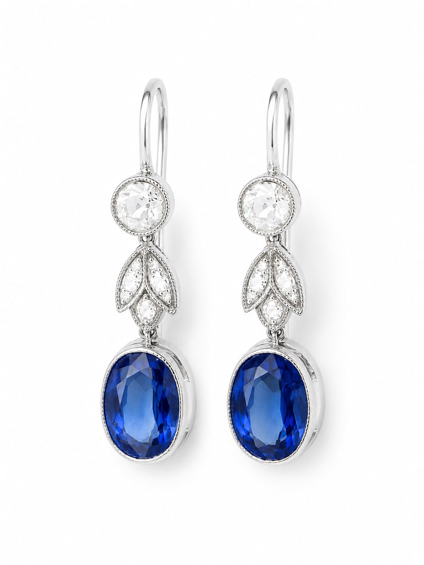 PAIR OF SAPPHIRE AND DIAMOND DROP EARRINGS: PAIR OF SAPPHIRE AND DIAMOND DROP EARRINGS,testing 18 ct. gold.Bright and lively diamonds.Rich and vibrant sapphires.L. 2.3 cm.