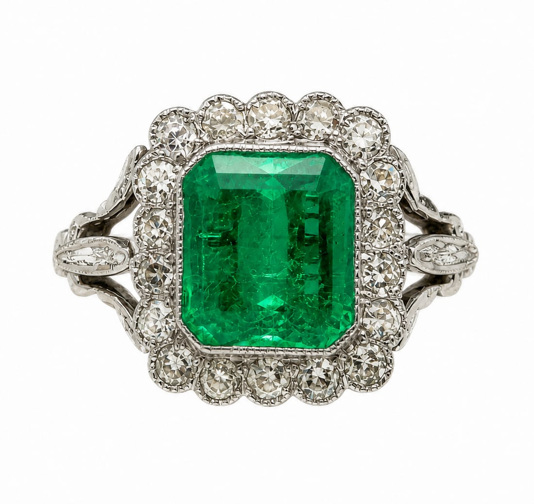 EMERALD AND DIAMOND CLUSTER RING: EMERALD AND DIAMOND CLUSTER RING,5.1 grams, testing high carat gold.Rich and vibrant emerald of approx. 1.85 ct.Diamonds bright and lively.Size M 1/2.