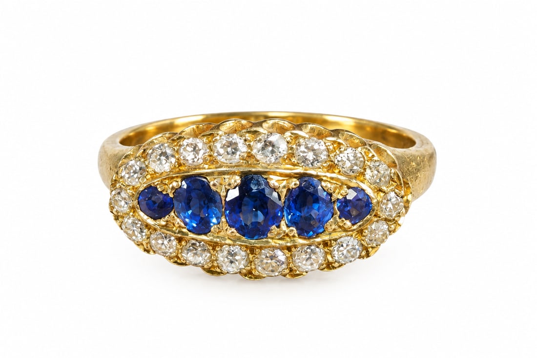 SAPPHIRE AND DIAMOND RING: SAPPHIRE AND DIAMOND RING,18 ct. gold.Rich and vibrant sapphires.Diamonds bright and lively.Size M.