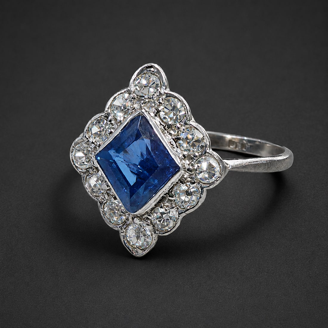 ART-DECO SAPPHIRE AND DIAMOND RING: ART-DECO SAPPHIRE AND DIAMOND RING,testing platinum.Rich and vibrant sapphire of approx. 1.15 ct.Diamonds bright and lively.Size Q.