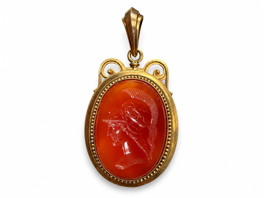 LARGE VICTORIAN HARDSTONE INTAGLIO PENDANT: LARGE VICTORIAN HARDSTONE INTAGLIO PENDANT,19.1 grams, testing 18 ct. gold.The large carved intaglio depicting Athena/Minerva.L. 6.2 cm.