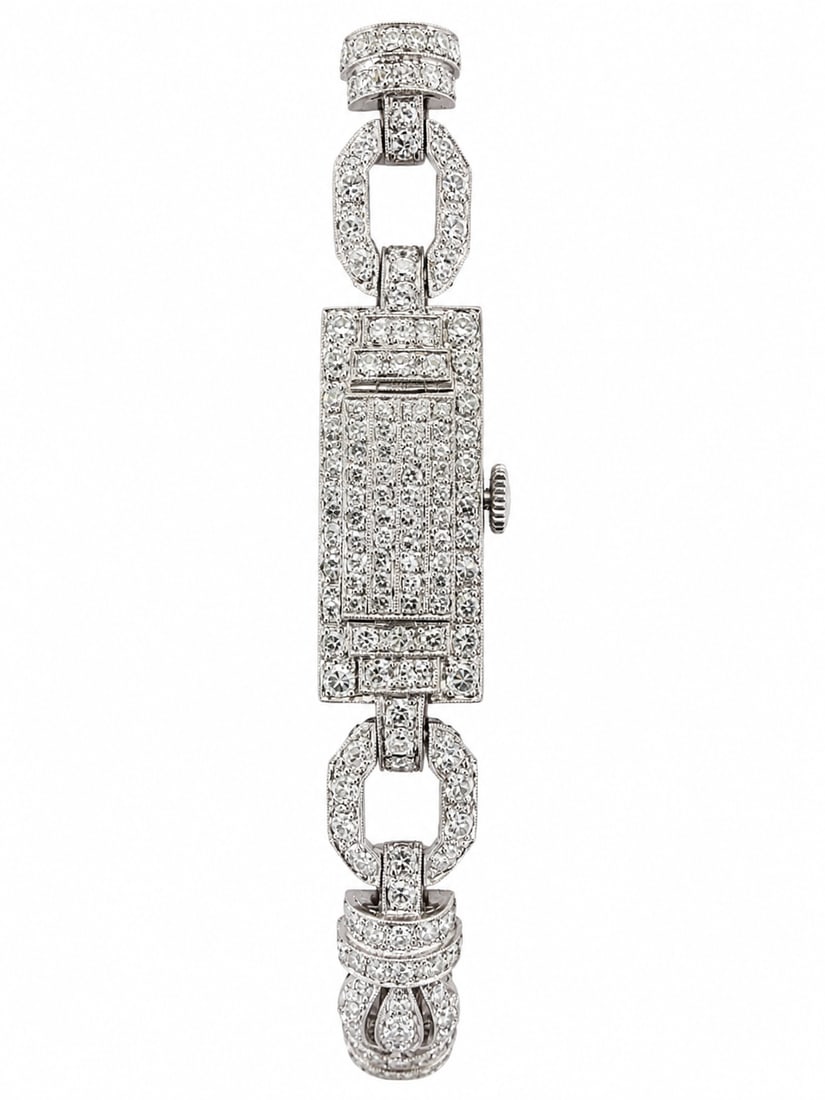 ART-DECO DIAMOND WATCH: ART-DECO DIAMOND WATCH,25,1 grams testing platinum.The watch hidden with a diamond set cover.Diamonds on the case and strap.Totalling approx. 4.50 ct.L.17.5 cm.