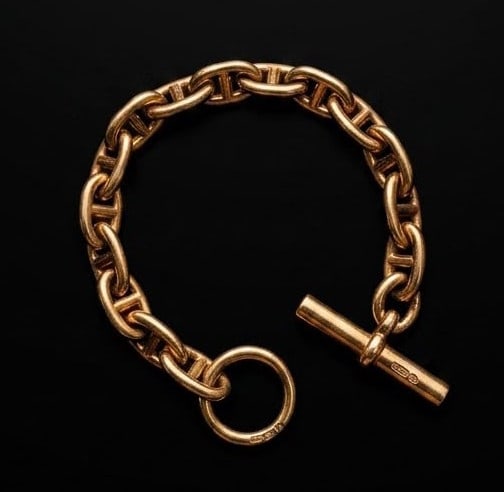 HERMES, A CHAIN D'ANCRE BRACELET: HERMES, A CHAIN D'ANCRE BRACELET in gilded silver, comprising a row of mariner links, signed Hermes, French maker's mark, French assay marks, stamped 925.L. 20.5 cm.56.3 grams.