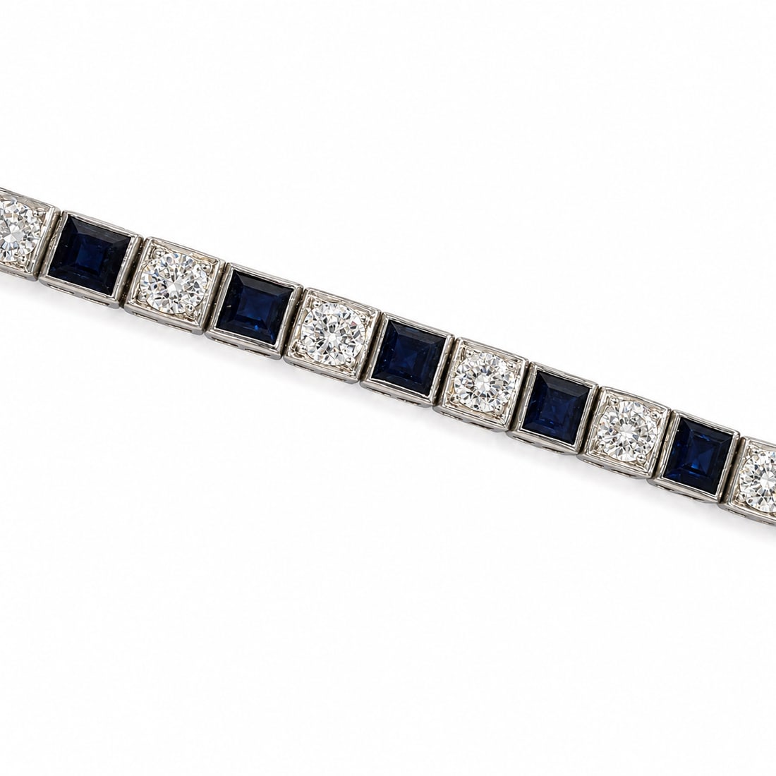 ART-DECO SAPPHIRE AND DIAMOND BRACELET: ART-DECO SAPPHIRE AND DIAMOND BRACELET,11,7 grams, testing high carat gold.Rich and vibrant sapphires, totalling approx. 4 ct.Diamonds bright and lively, totalling approx. 4.60 ct.L. 18 cm.