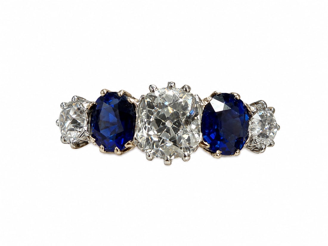FINE SAPPHIRE AND DIAMOND 5-STONE RING: FINE SAPPHIRE AND DIAMOND 5-STONE RING,4.4 grams, testing high carat gold.Bright and lively old cut diamonds, totalling approx. 1.60 ct. With a larger central diamond of approx. 1.10 ct.Rich and vibra