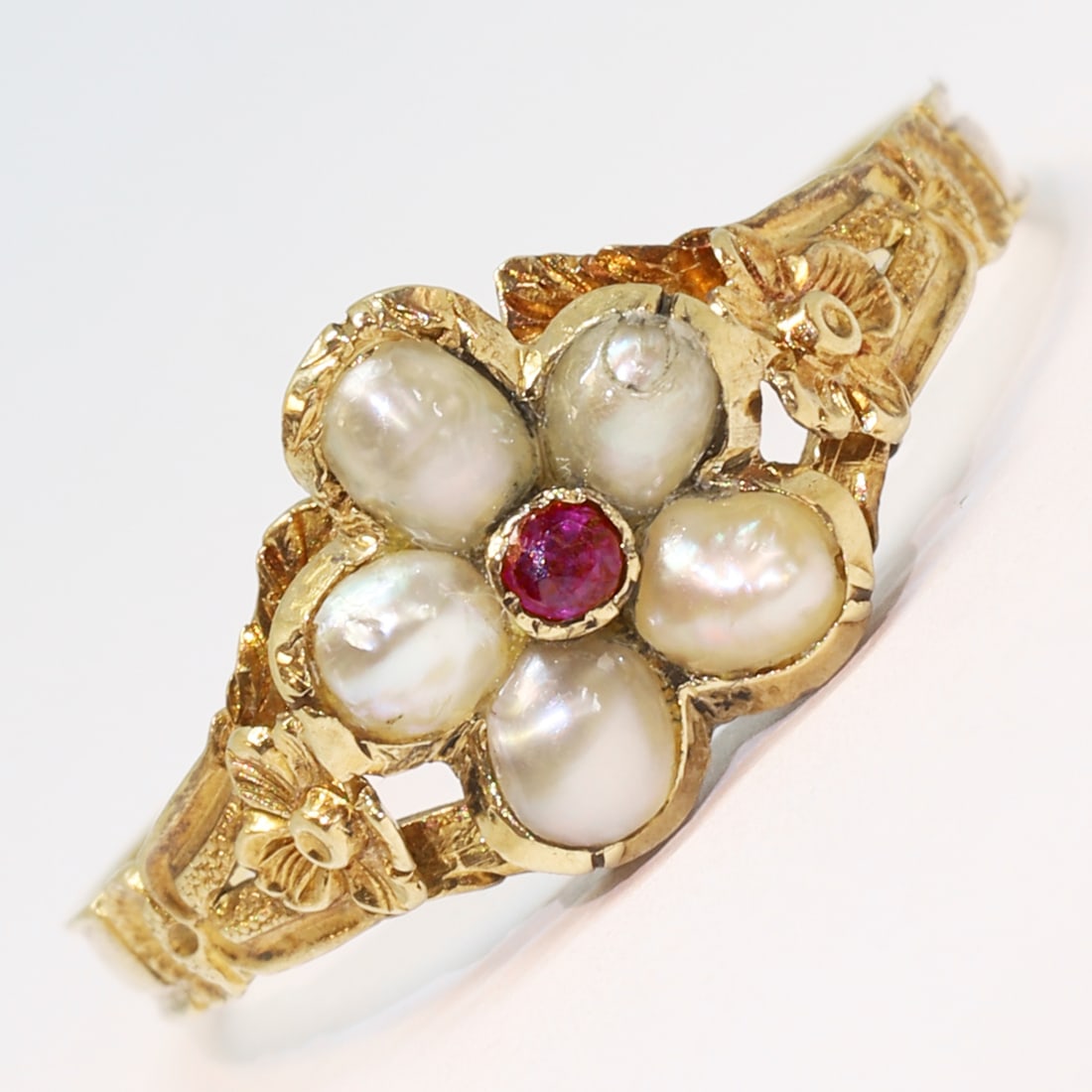 ANTIQUE RUBY AND PEARL CLUSTER RING: ANTIQUE RUBY AND PEARL CLUSTER RING,testing high cart gold.Vibrant ruby.Lovely pearls.Locket back.Size Q 1/2.