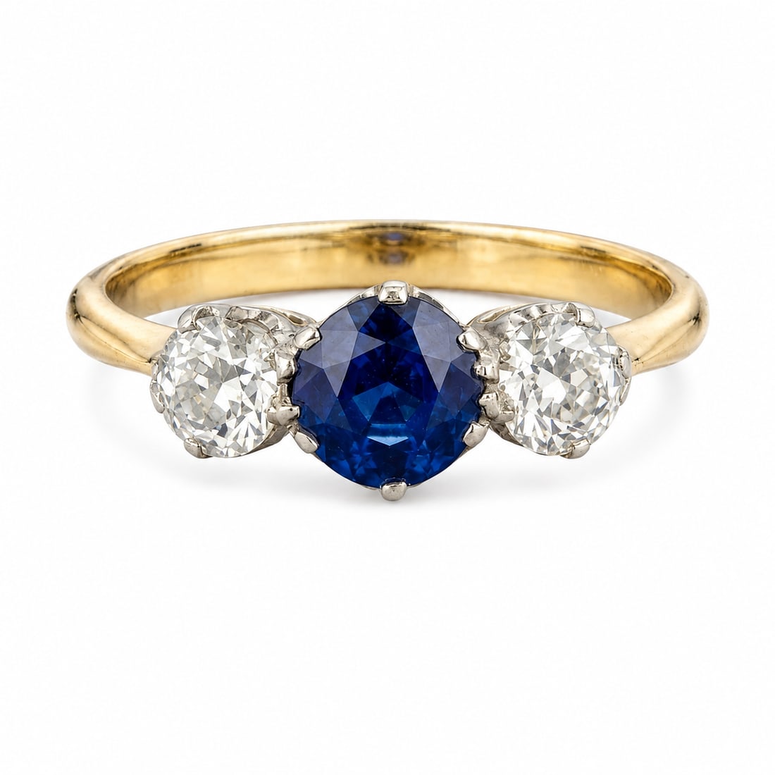SAPPHIRE AND DIAMOND 3-STONE RING: SAPPHIRE AND DIAMOND 3-STONE RING,18 ct. gold and platinum.Rich and vibrant sapphire.Bright and lively diamonds.Size K 1/2.