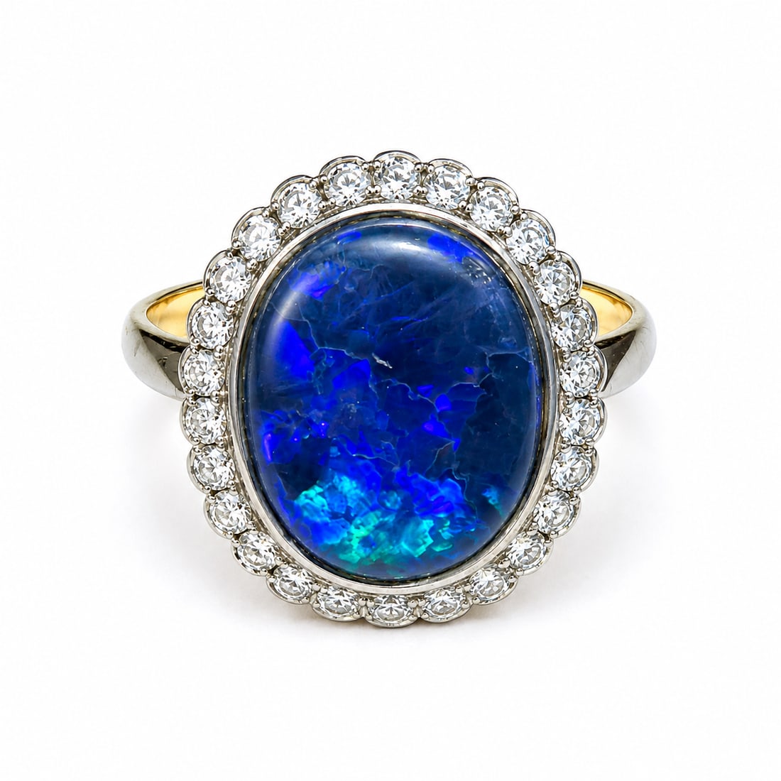 BLACK OPAL AND DIAMOND CLUSTER RING: BLACK OPAL AND DIAMOND CLUSTER RING,4,7 grams, testing high carat gold.Fine black opal of approx. 13.4 x 10.8 mm.Size O 1/2.