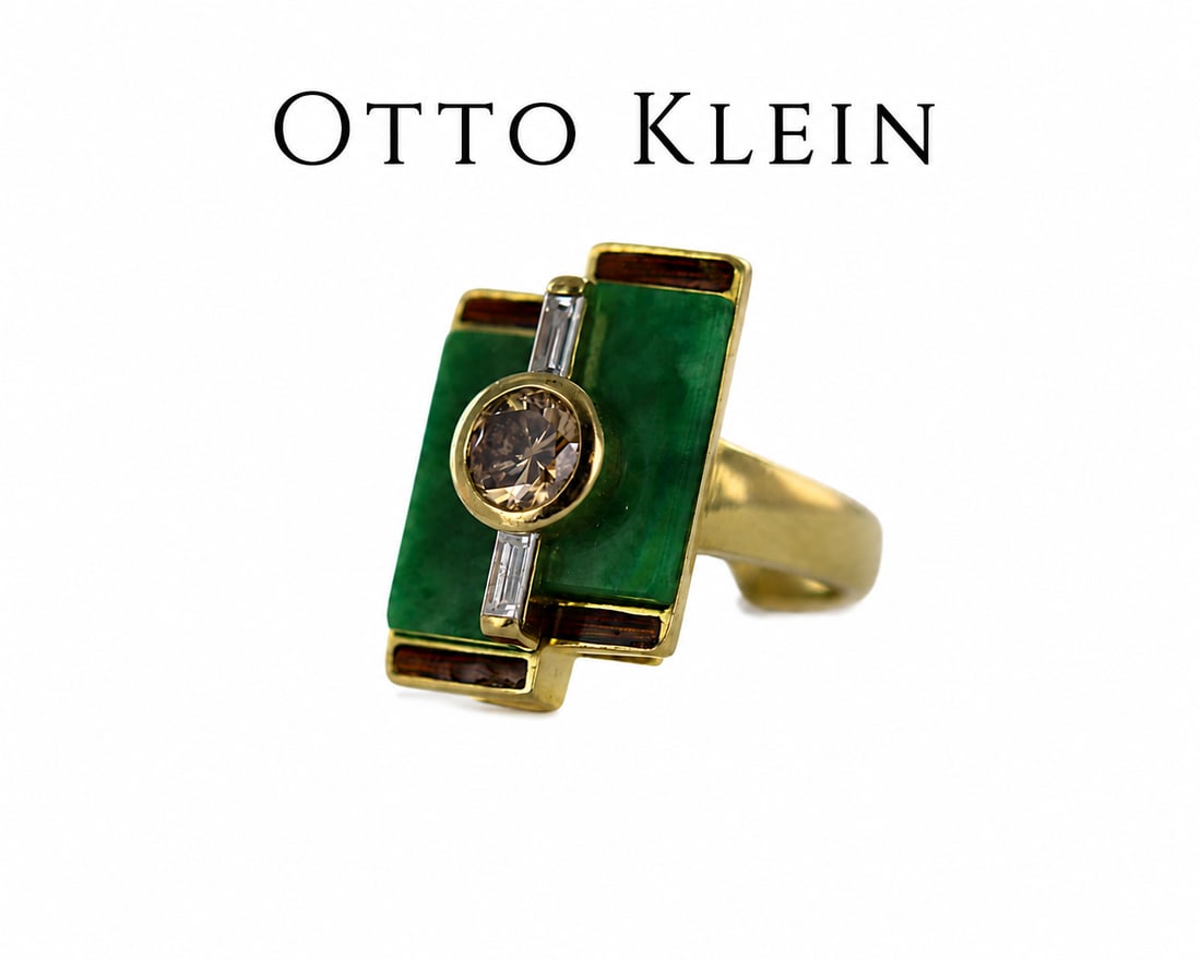 OTTO KLEIN, FANCY COLOUR DIAMOND, JADE AND ENAMEL RING: OTTO KLEIN, FANCY COLOUR DIAMOND, JADE AND ENAMEL RING,18.2 grams, 18 ct. gold.The centre with a fancy coloured diamond.Lovely jade plaques.Enamel ends.Makers Mark Otto Klein.Size P 1/2.