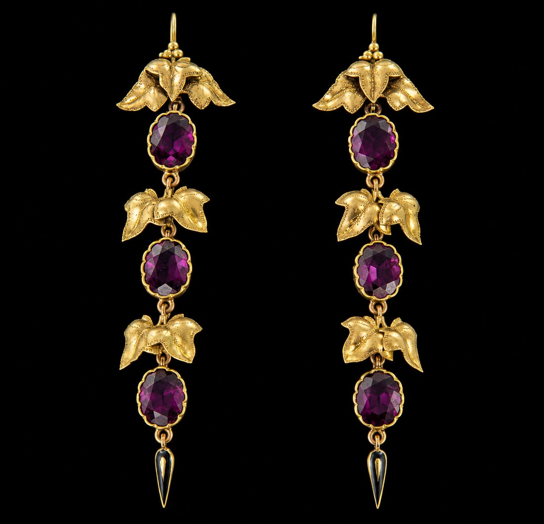 PAIR OF ANTIQUE GARNET DROP EARRINGS: PAIR OF ANTIQUE GARNET DROP EARRINGS, 6,4 grams, testing high carat gold.Right and vibrant garnets.Fine articulated.Enamel tassel drop.L. 7 cm.
