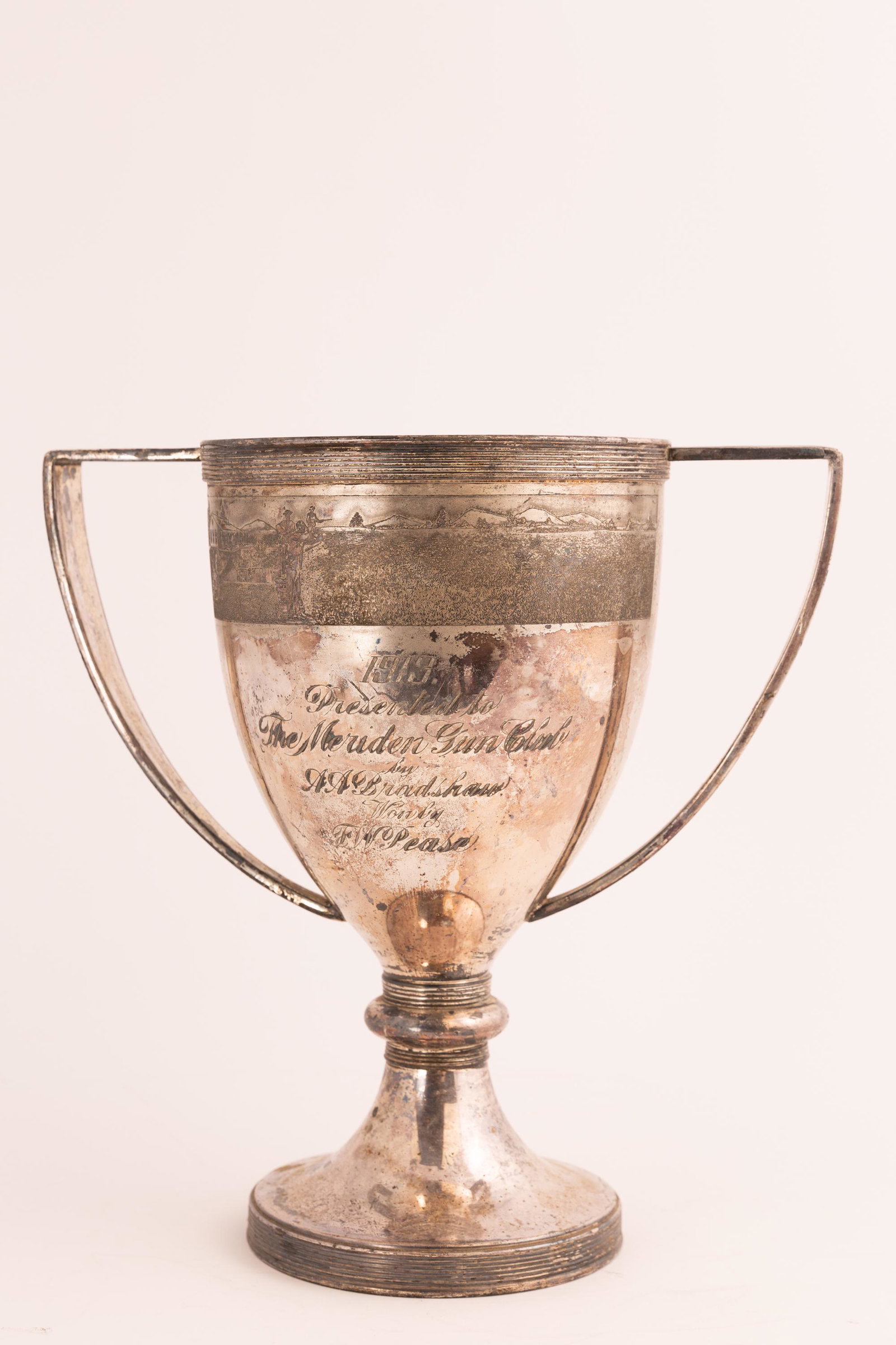 Silverplate Shooting Trophy for the Meriden Gun Club: by Meriden. With Landscape Border and Sportsmen. Hallmarked and inscribed as Shown. 10 3/4" x 10 1/2" x 6".