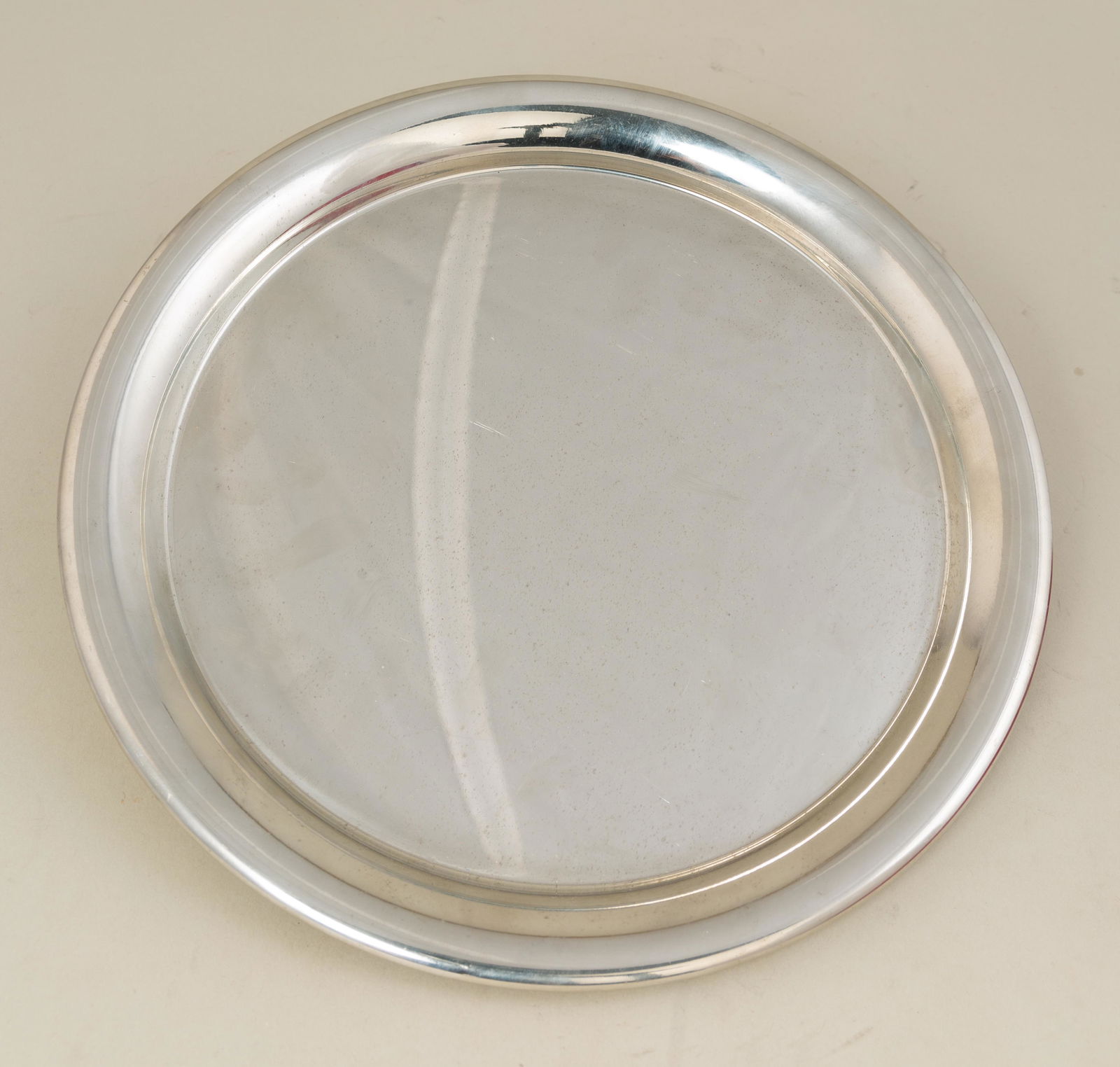 Cartier Platter with Case: Round Pewter Cartier Platter with Red Case and Cloth. Hallmarked as Pictured. 11" diameter.